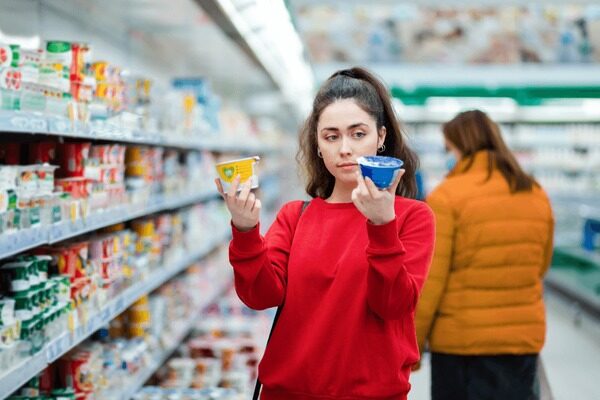 Young Woman Chooses Products